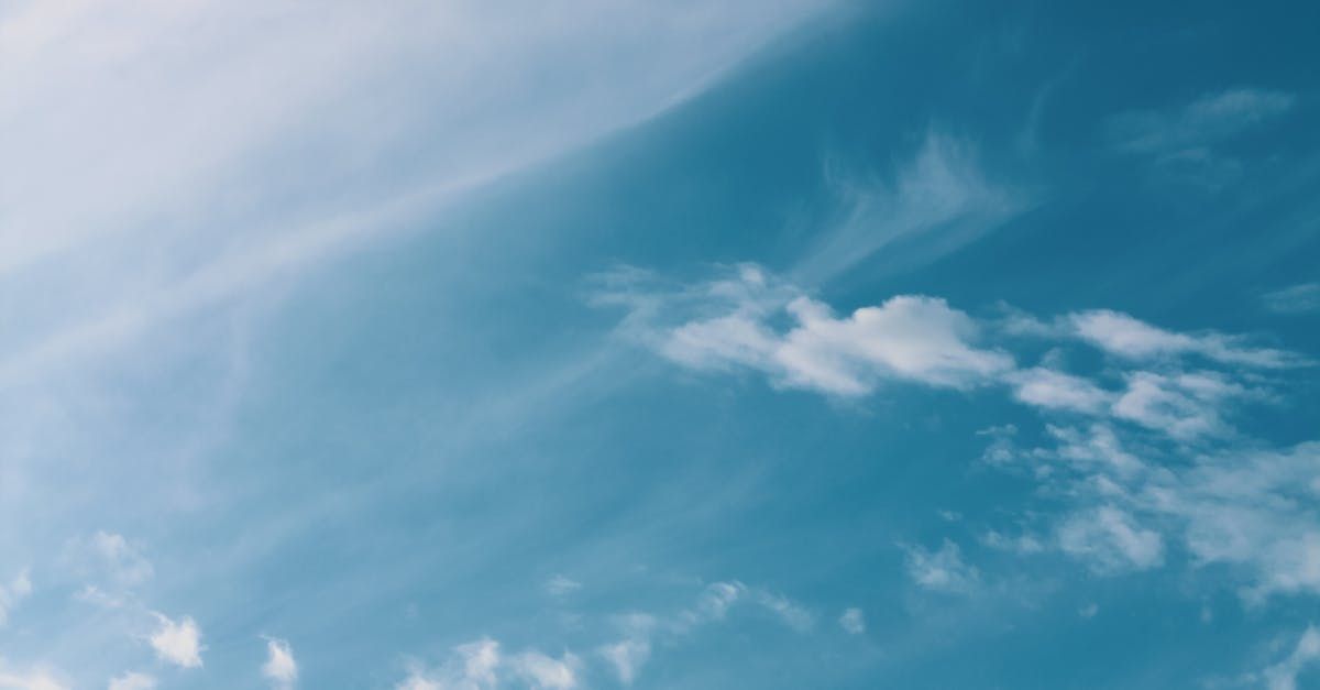A blue sky with white clouds in it