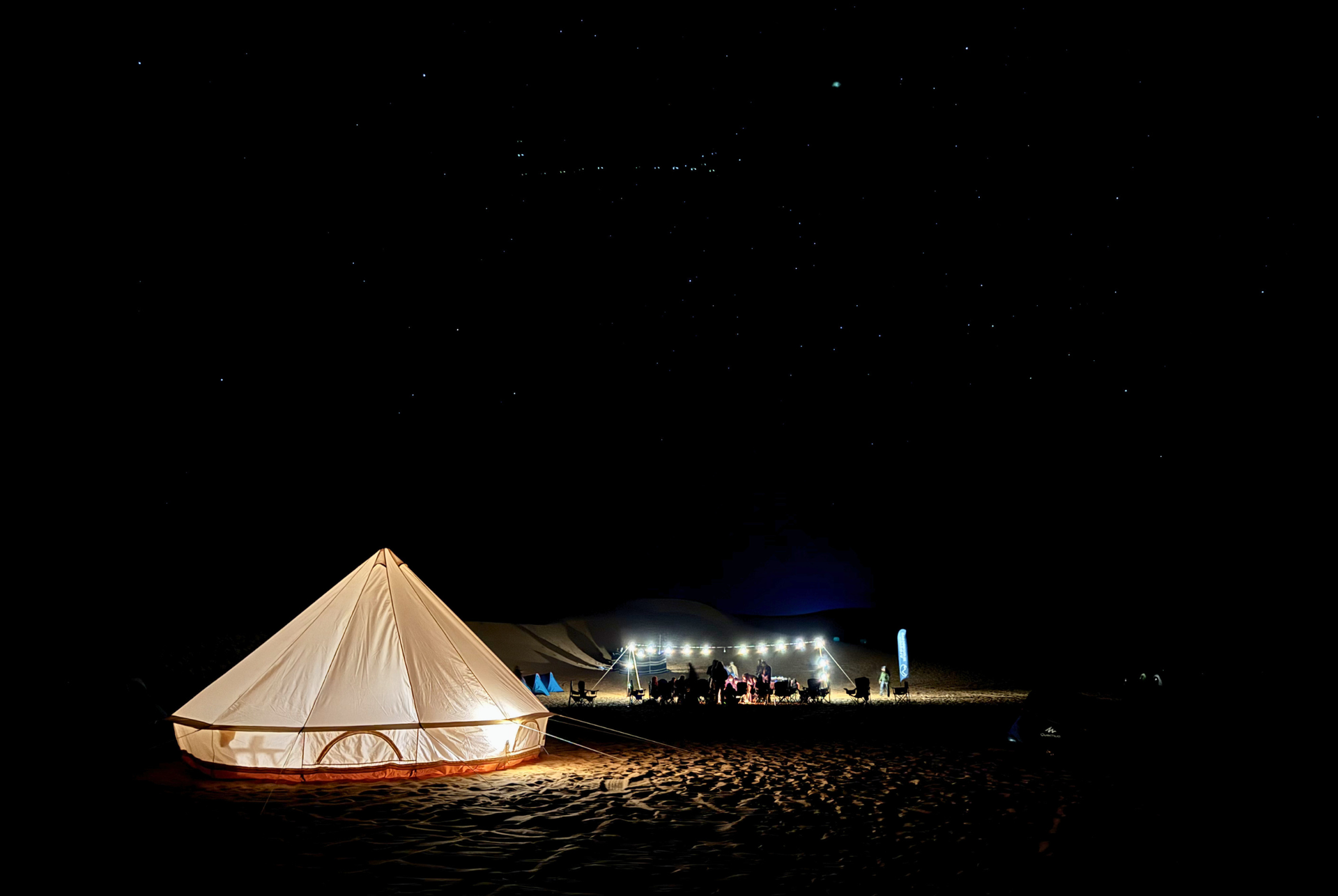 Illuminated glamping tent at night in Al Quaa.