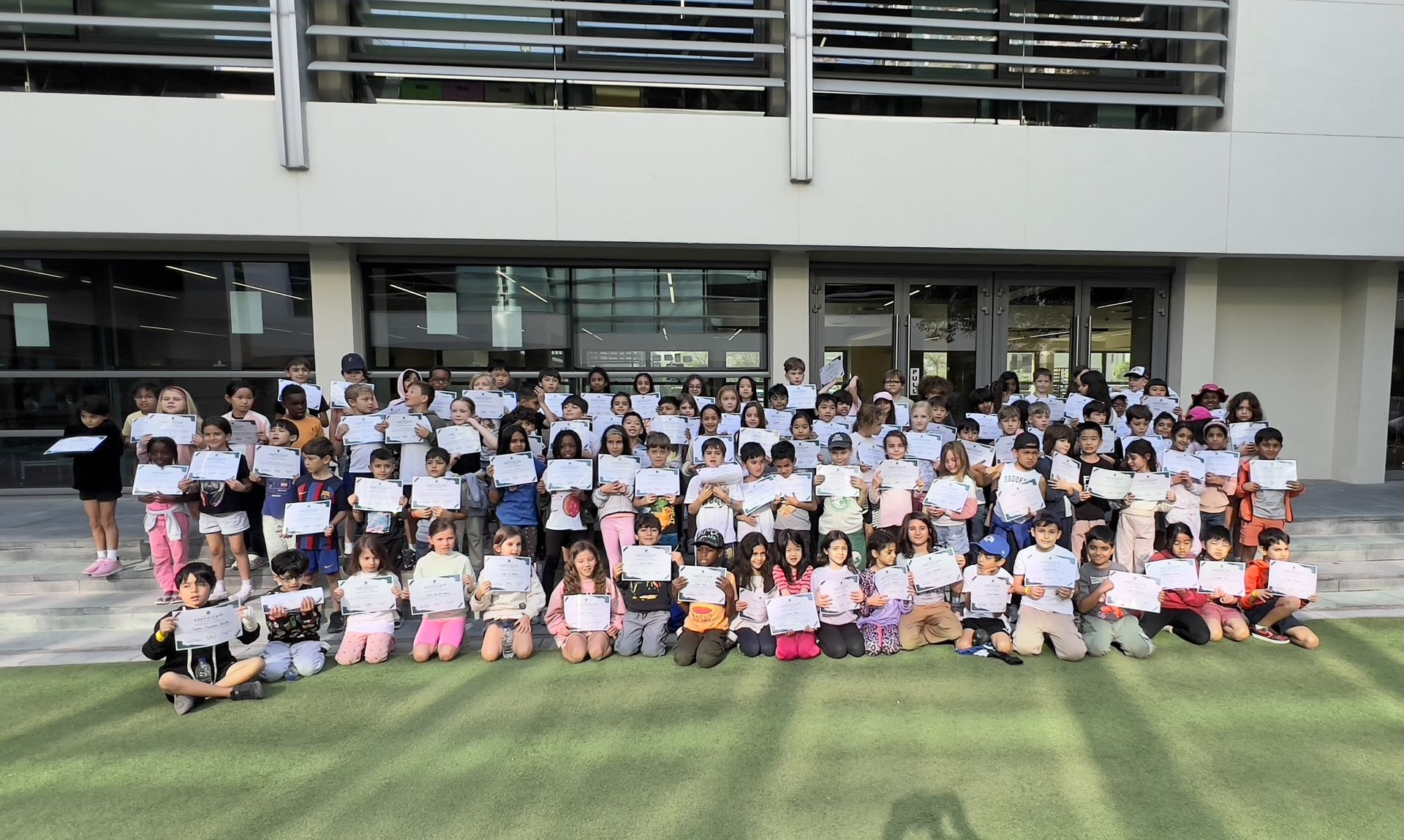 Students receiving their certificates after completing an in-school camping experience with Arabian Wanderers.