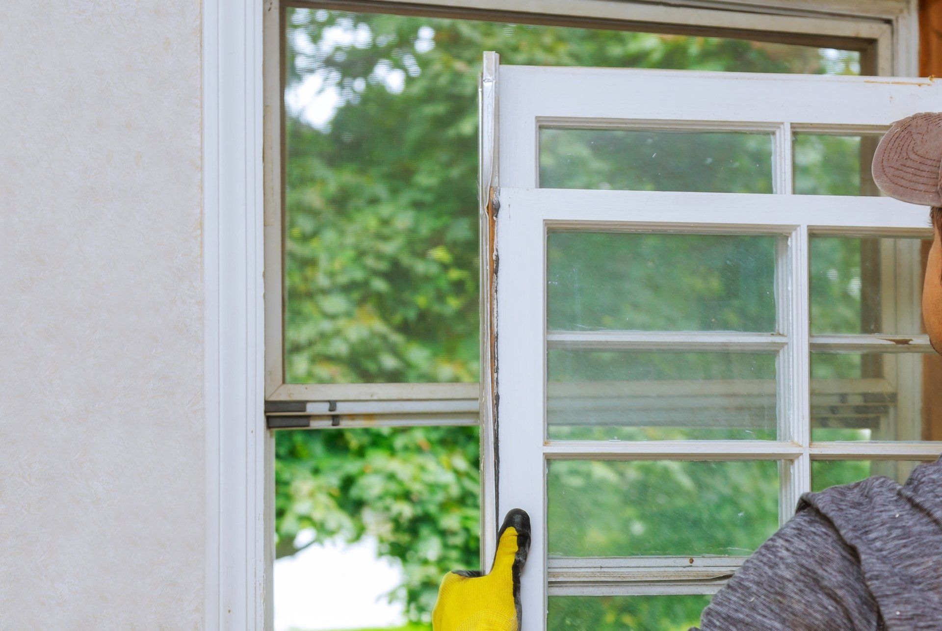 close up of installing a wooden frame window