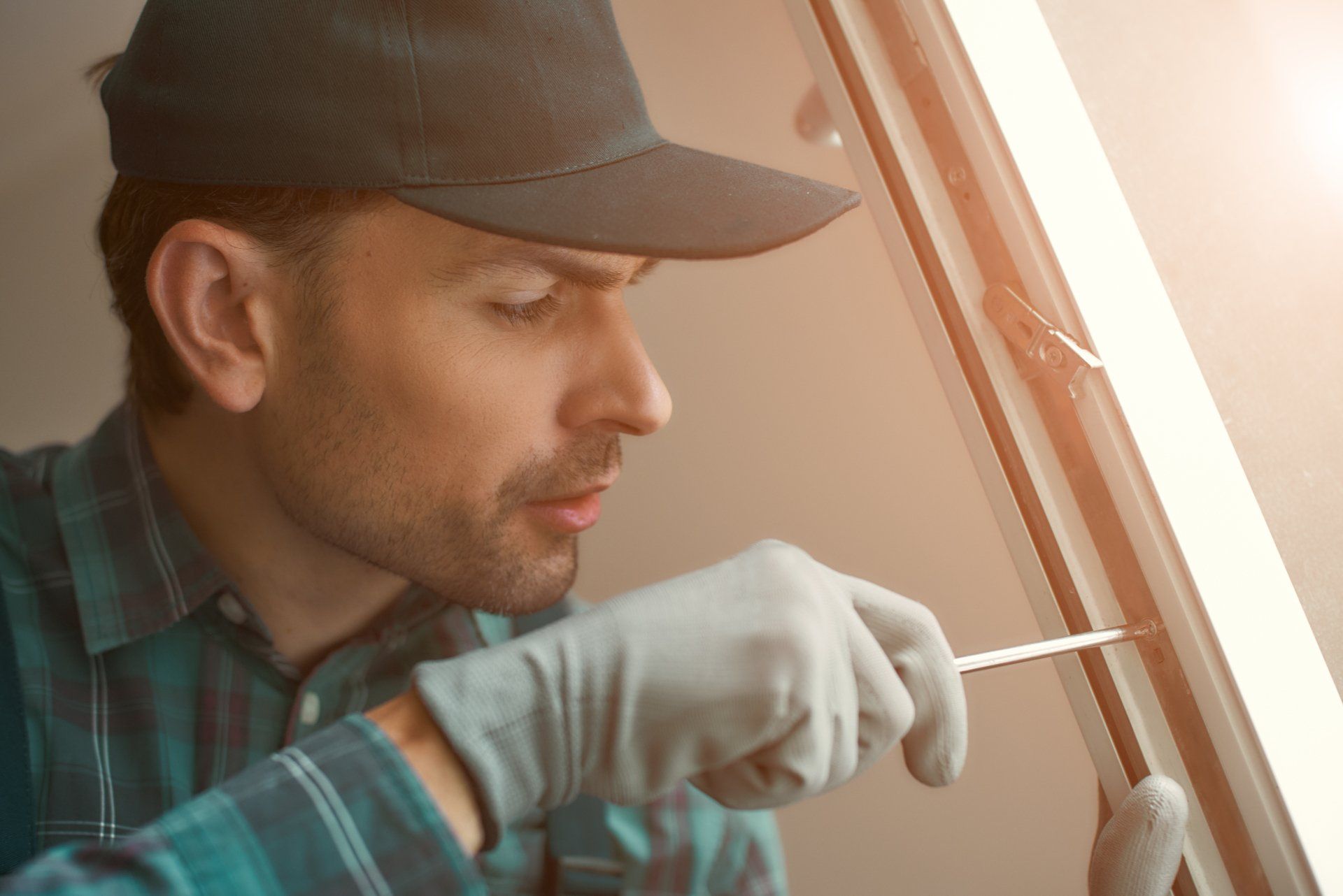 man repairing a window