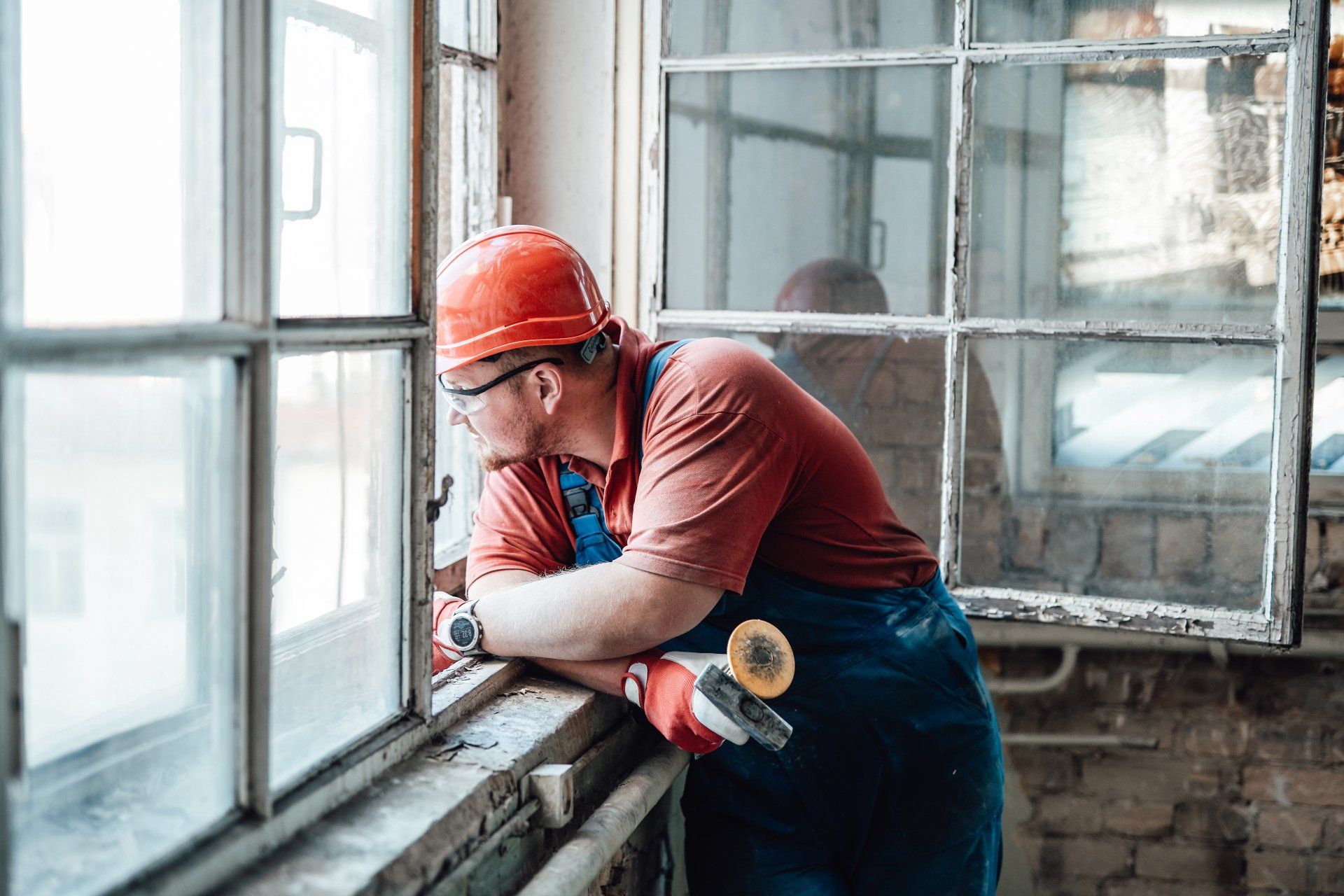 worker looks out a window