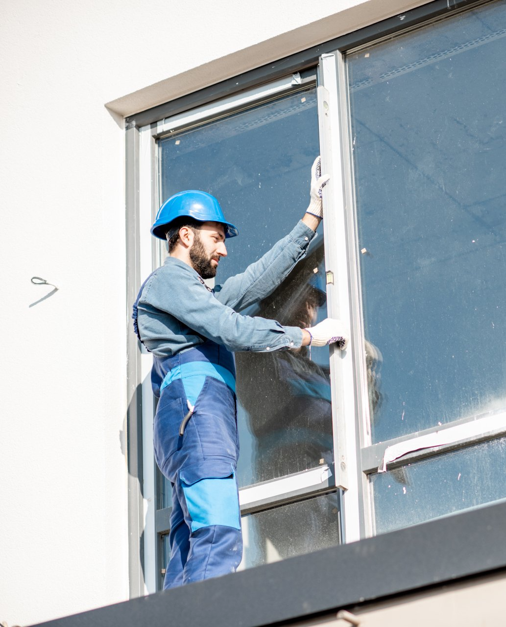 a man doing window repair on a site