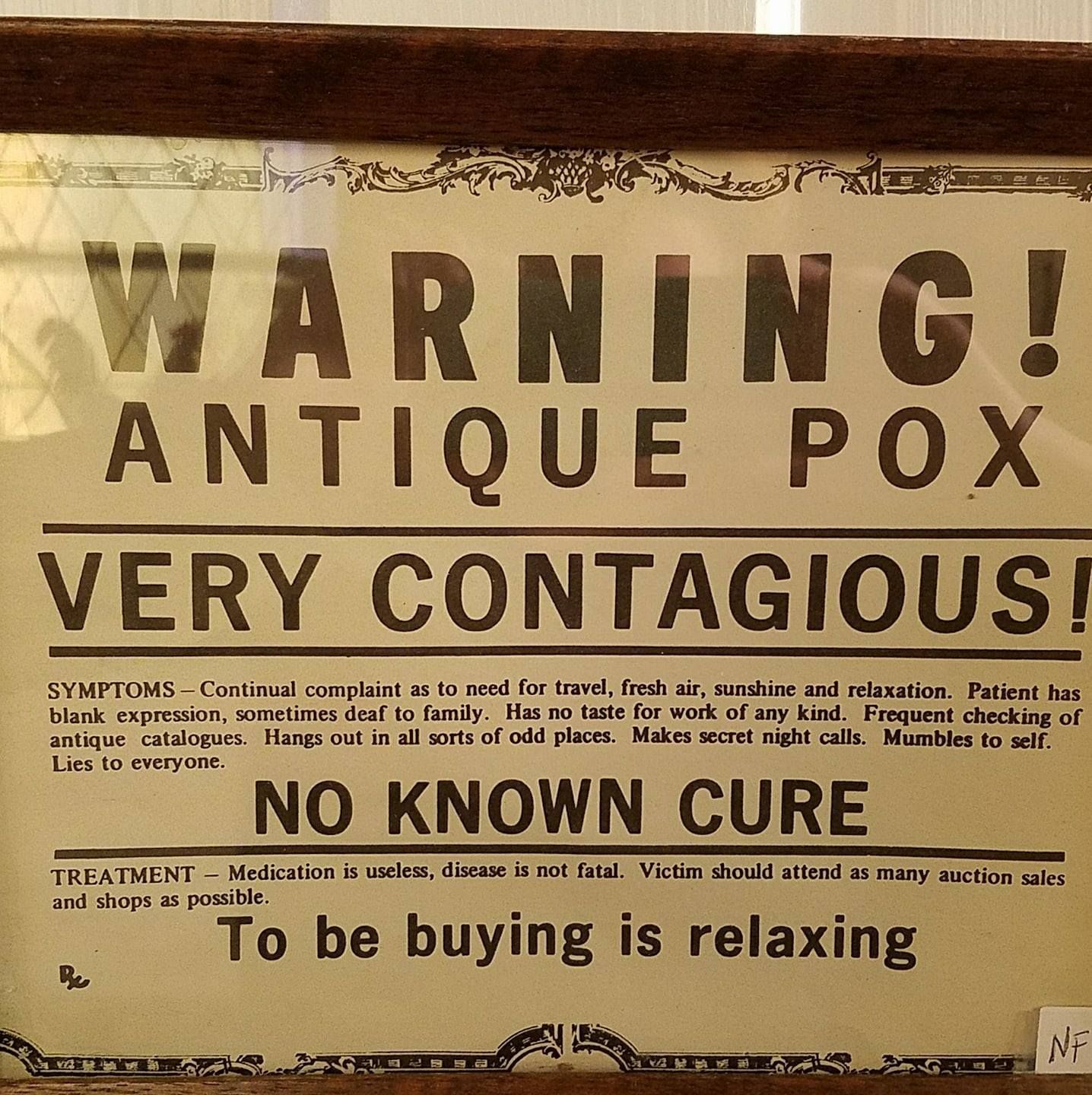 Sign describing how antiquing is very contagious at antique shop, Hartford, WI