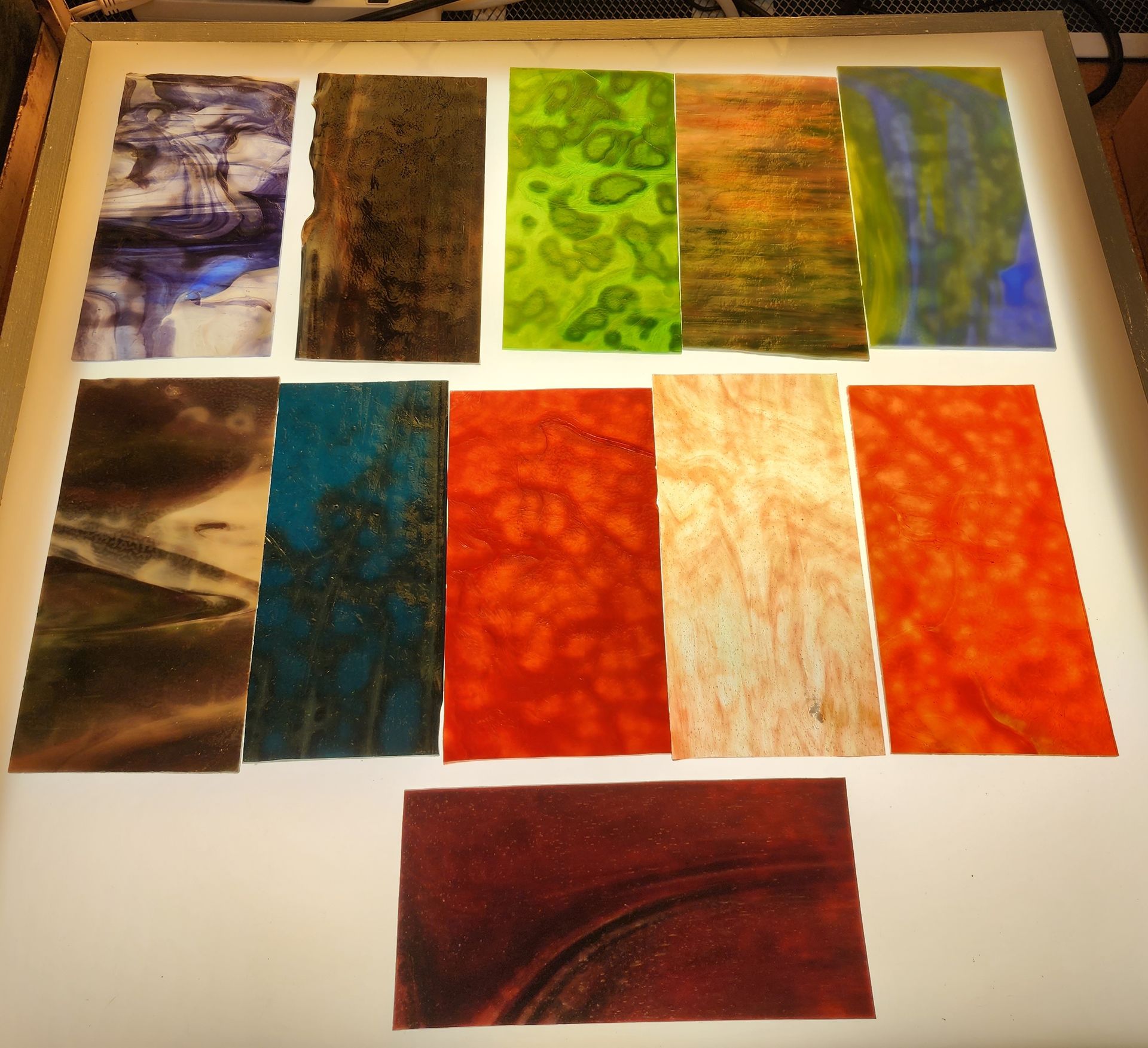 Mottled Chicago Art Glass in shades of sea green, redish pink and orange for you next stained glass project. 