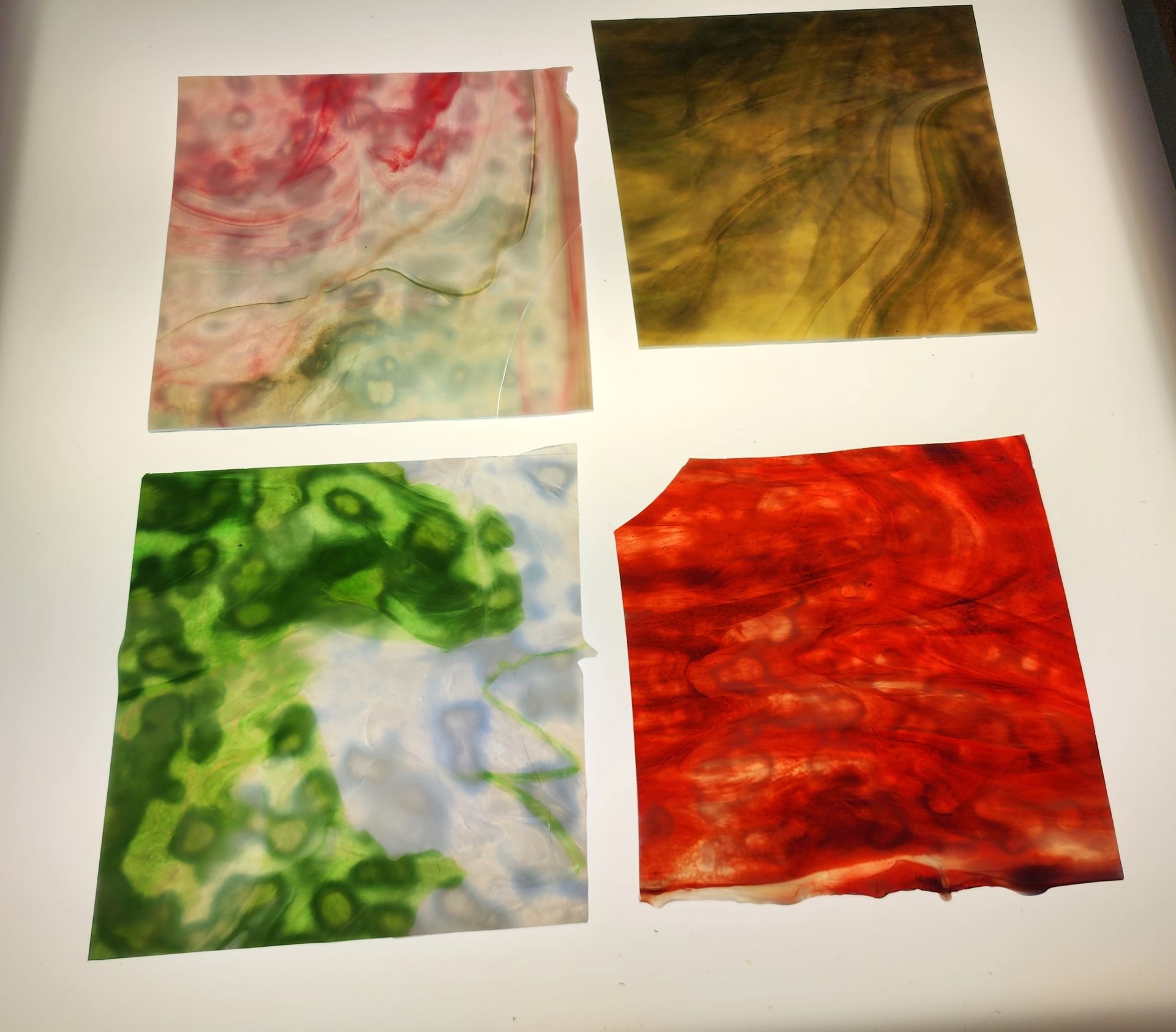 Mottled Chicago Art Glass sheets in shades of pink, green and red work perfect for stained glass lamp projects. 