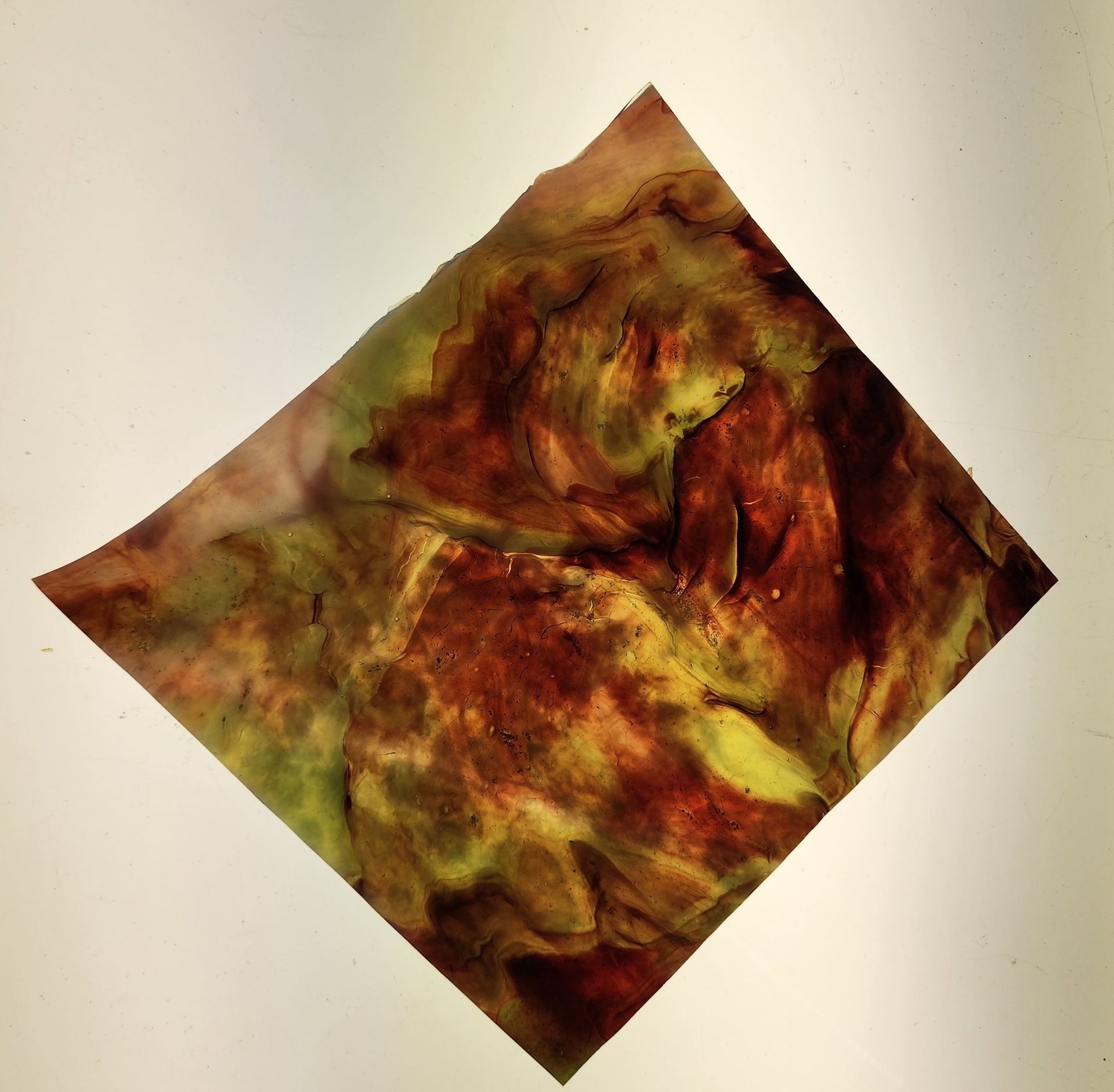Dark red with swirls of green and yellow Chicago Art Glass would look great in your next stained glass project!