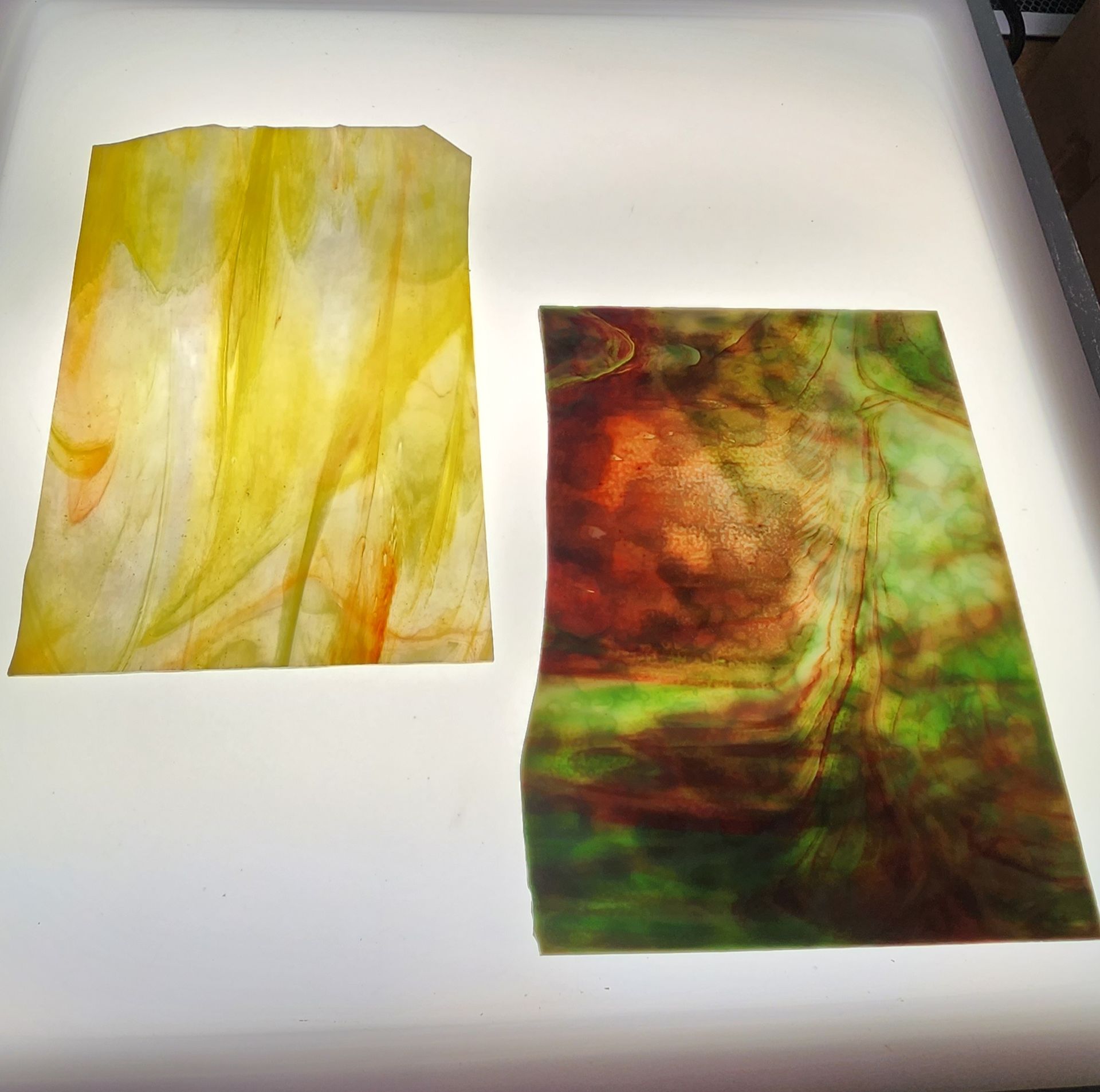 Yellow and white with hints of orange sheet glass and red and green mottle sheet glass for your art glass projects. 
