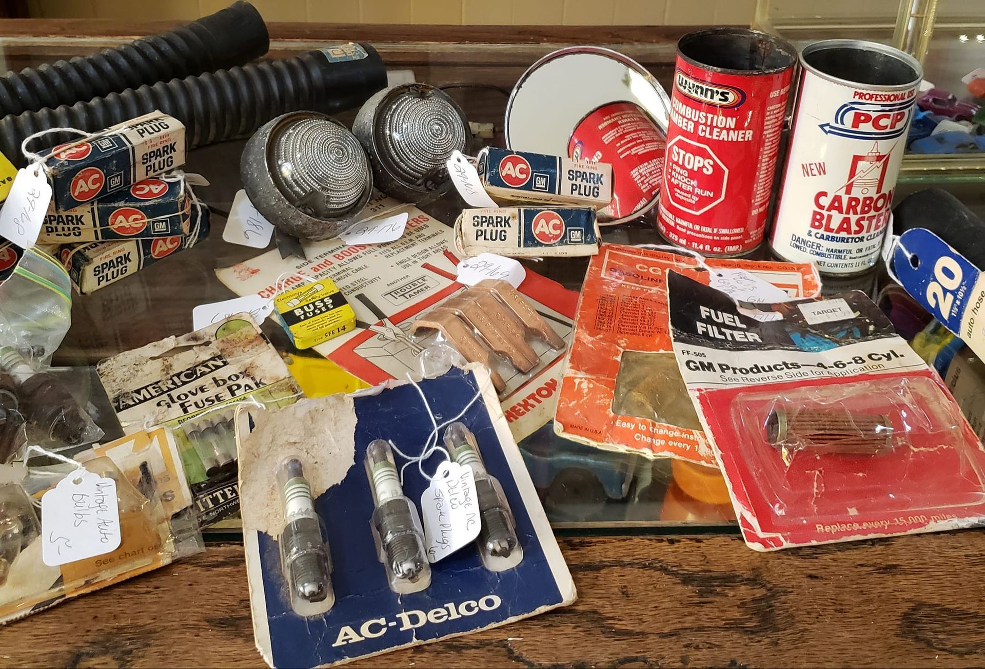 New old stock car parts including spark plugs, refelctors, lamps for the car enthusiast as Hen Picked Antiques. 