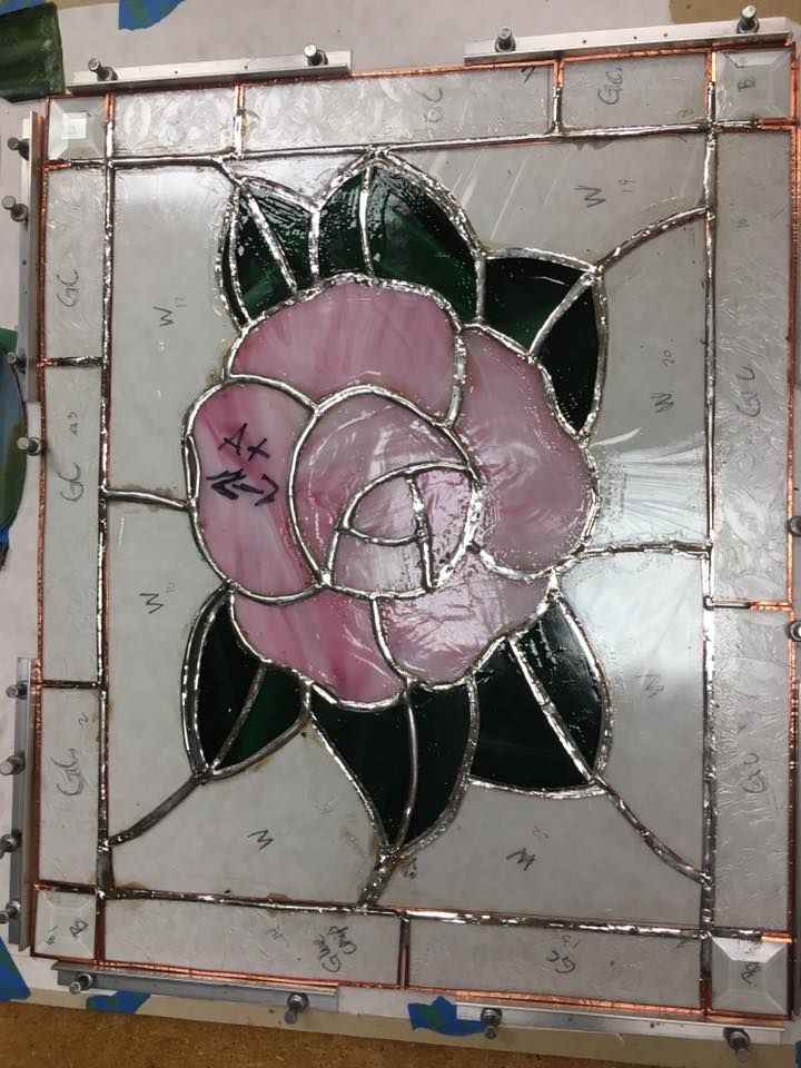 Student stained glass project-pink colored rose with clear background, Hartford, WI. 