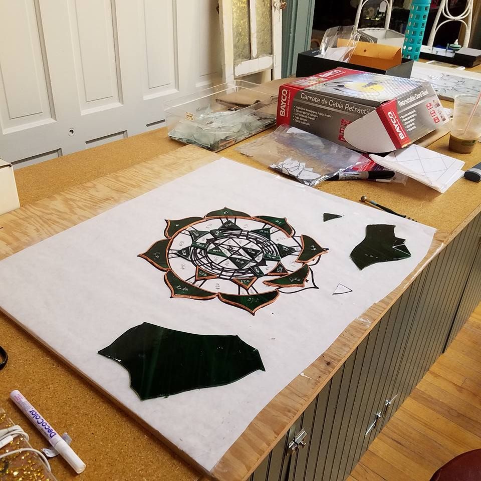 Student stained glass project laid out on pattern paper at Hen Picked Antiques i& Stained Glass n Hartford, Wisconsin. 