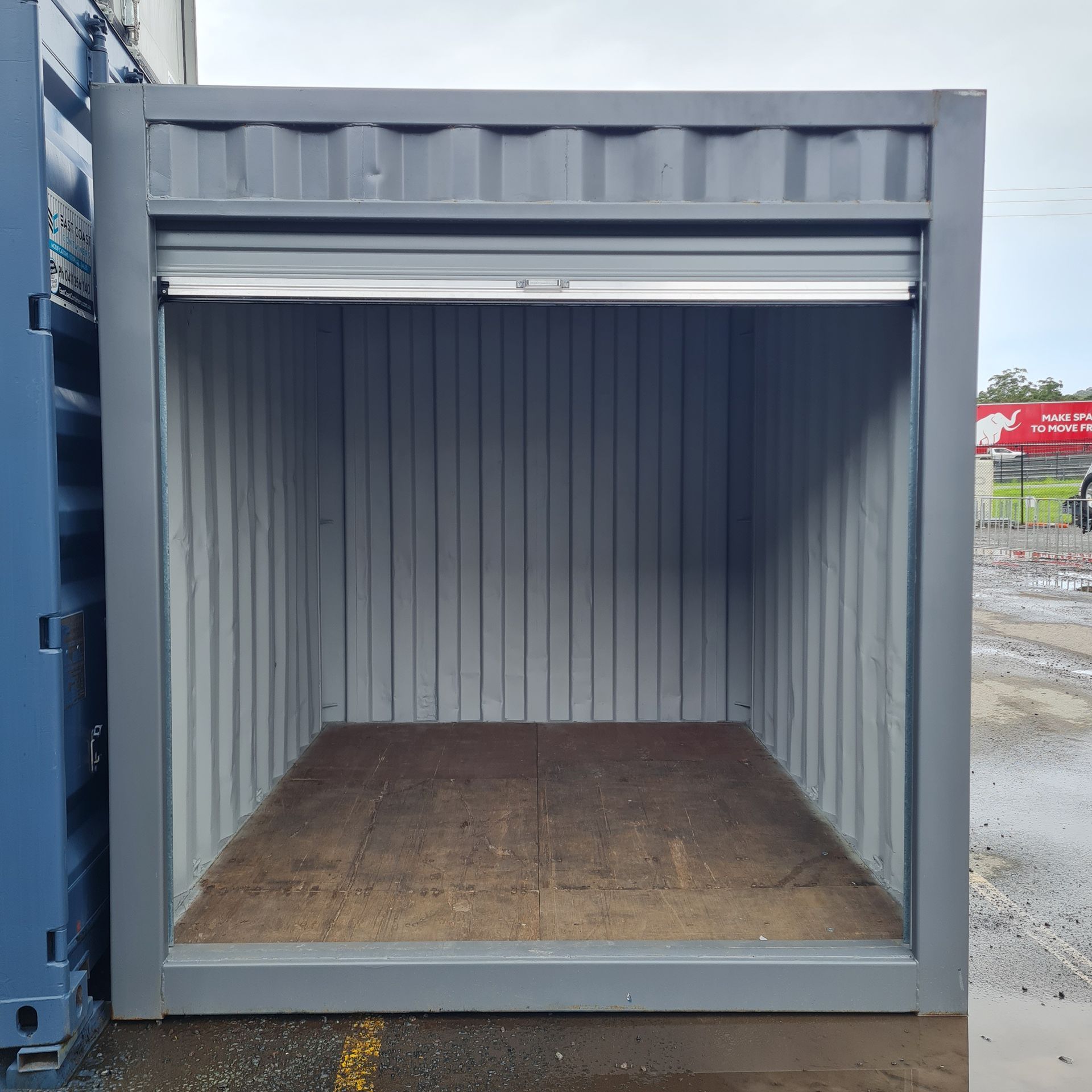 Open Gray Shipping Container — East Coast Containers Shipping Containers and Transport in Chevallum, QLD