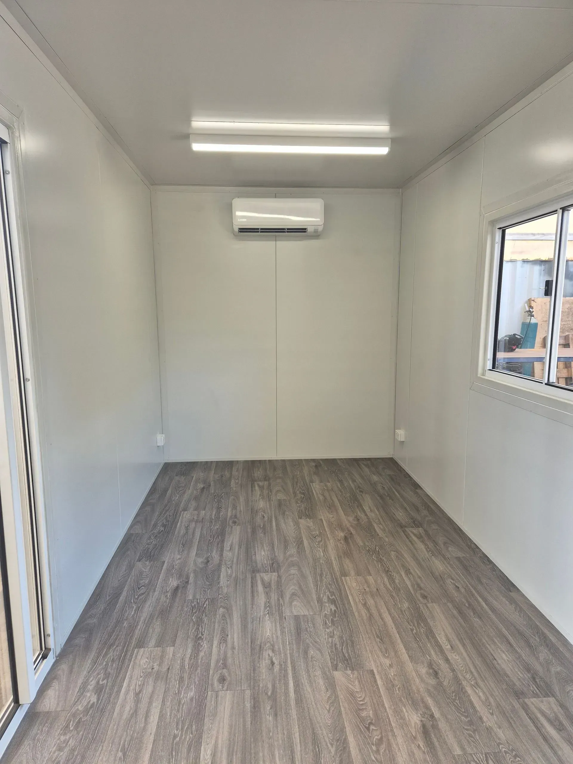 Empty, Rectangular Room With Gray Flooring — East Coast Containers Shipping Containers and Transport in Gympie, QLD