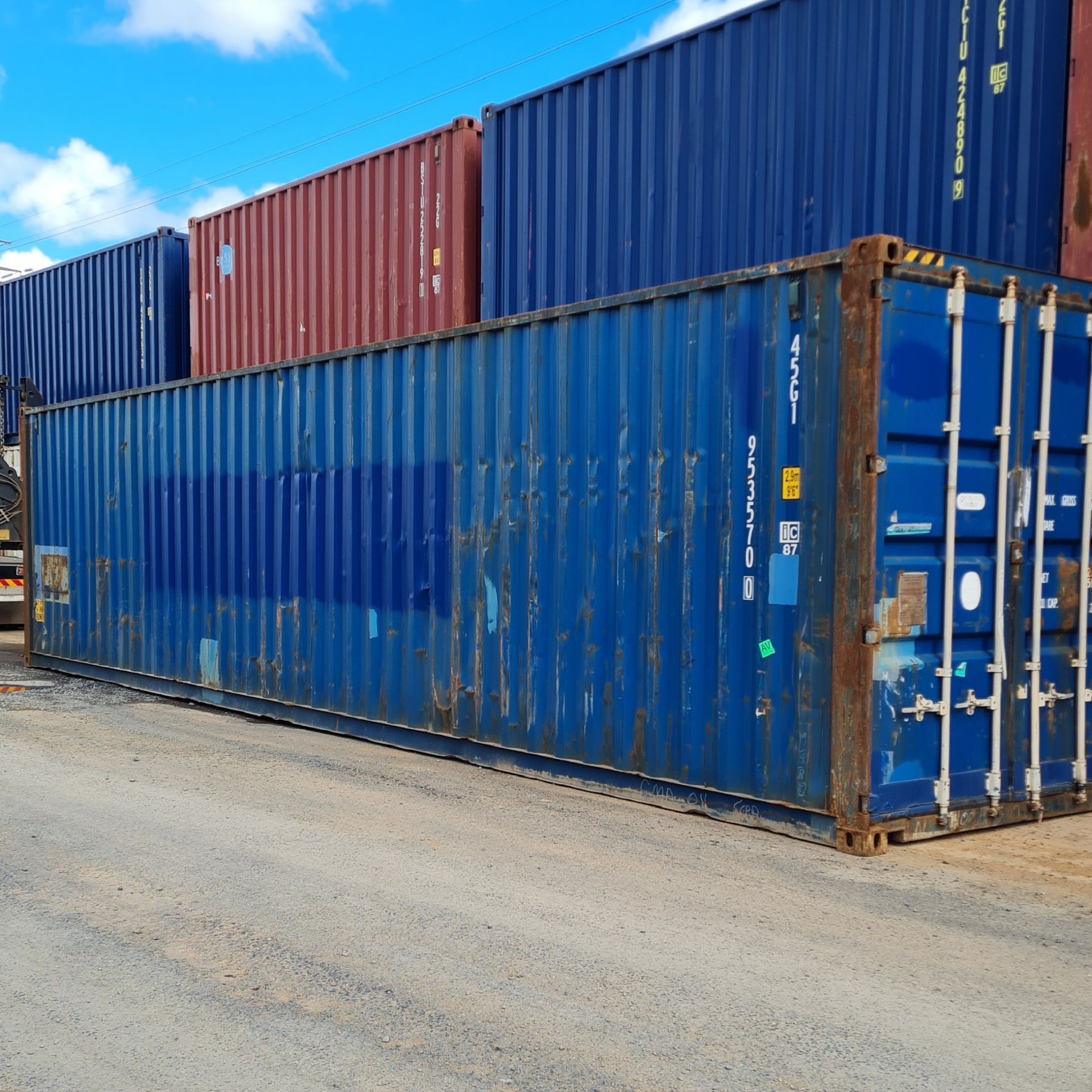Stacked Blue and Red Shipping Containers — East Coast Containers Shipping Containers and Transport in Chevallum, QLD