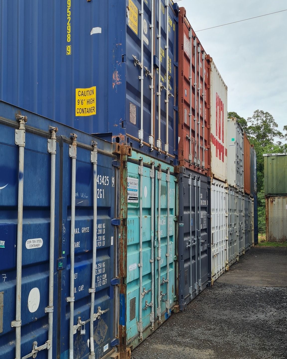 Row of Colourful Shipping Containers — East Coast Containers Shipping Containers and Transport in Brisbane, QLD