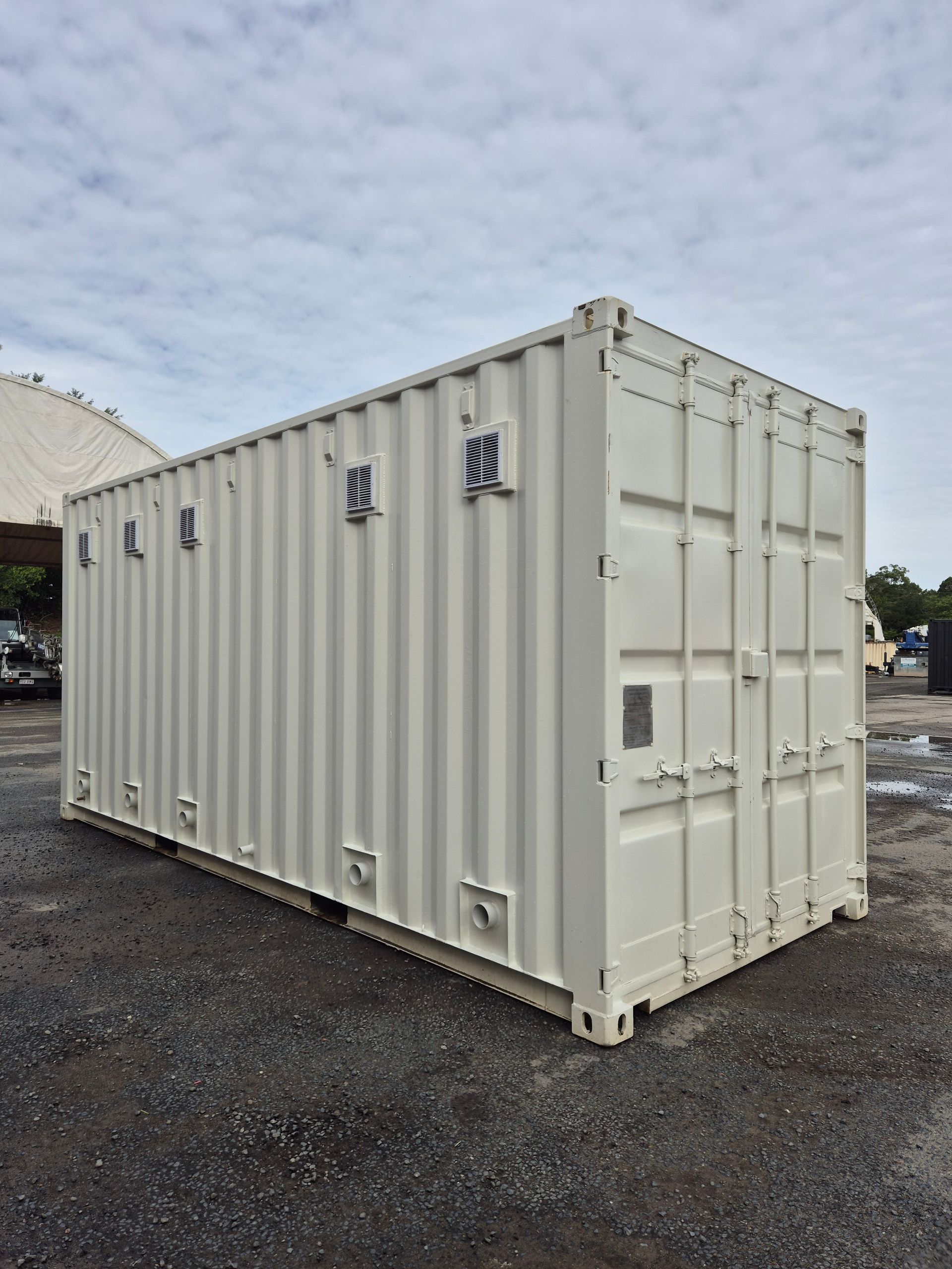 A White Shipping Container Stands on a Gravel on the East Coast A White Shipping Container — East Coast Containers Shipping Containers and Transport in Chevallum, QLD