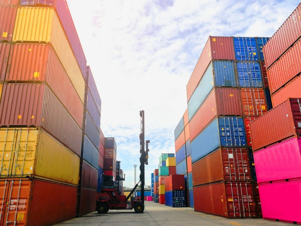 A Reach Stacker Crane Moves Shipping Containers — East Coast Containers Shipping Containers and Transport in Chevallum, QLD A Reach Stacker Crane Moves Shipping Containers — East Coast Containers Shipping Containers and Transport in Chevallum, QLD