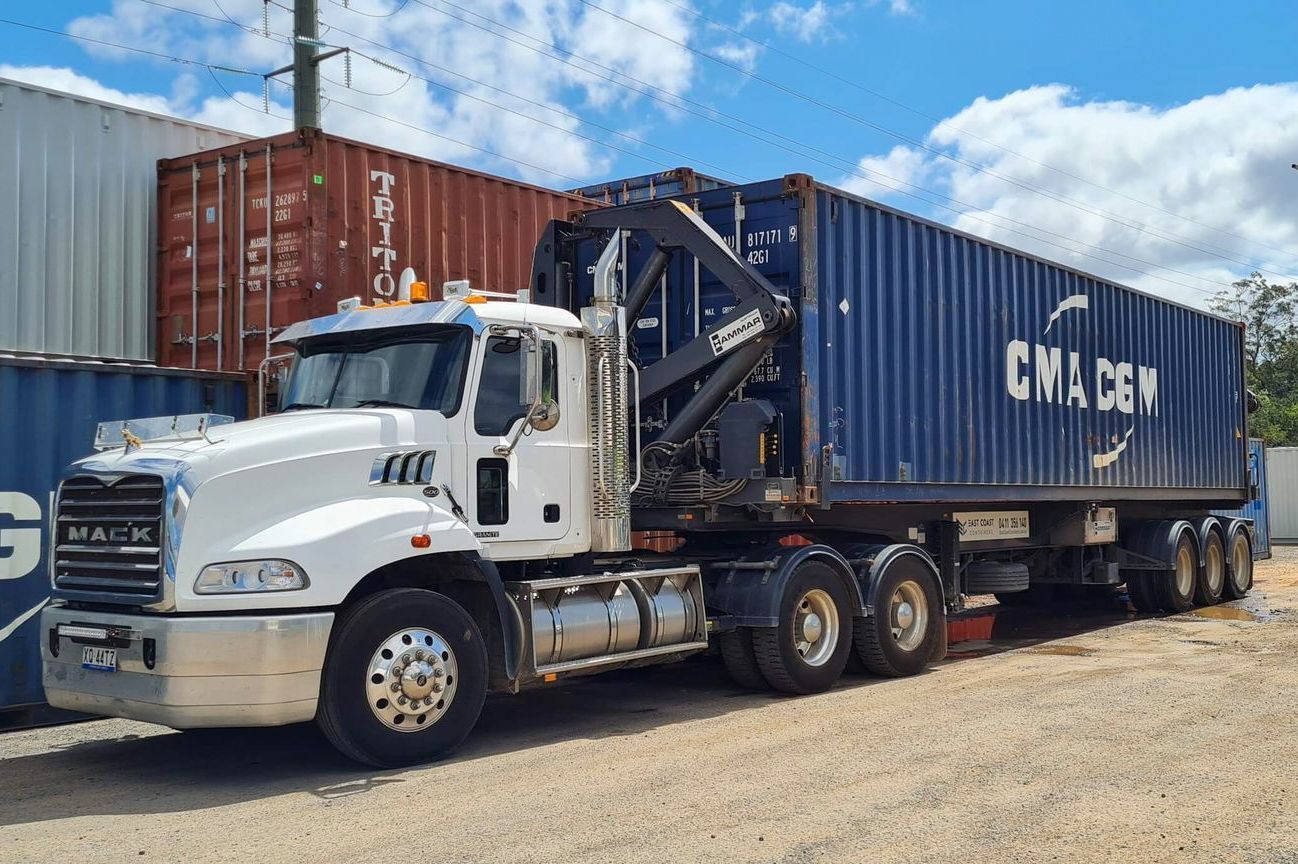 White Semi-truck Hauling Blue Shipping Containers — East Coast Containers Shipping Containers and Transport in Chevallum, QLD