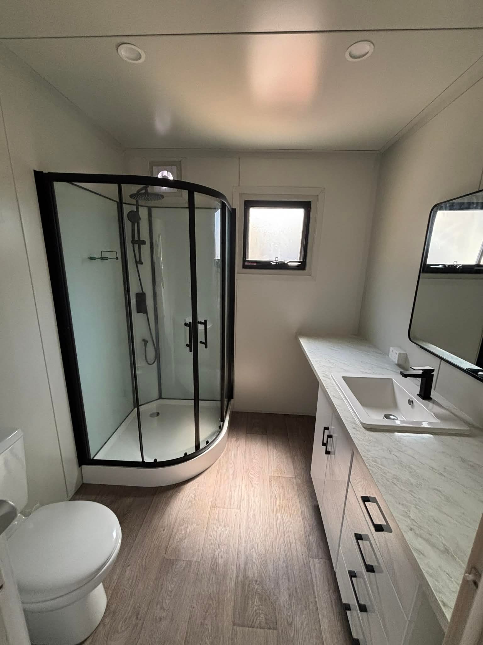 Modern Bathroom With Glass Shower — East Coast Containers Shipping Containers and Transport in Chevallum, QLD