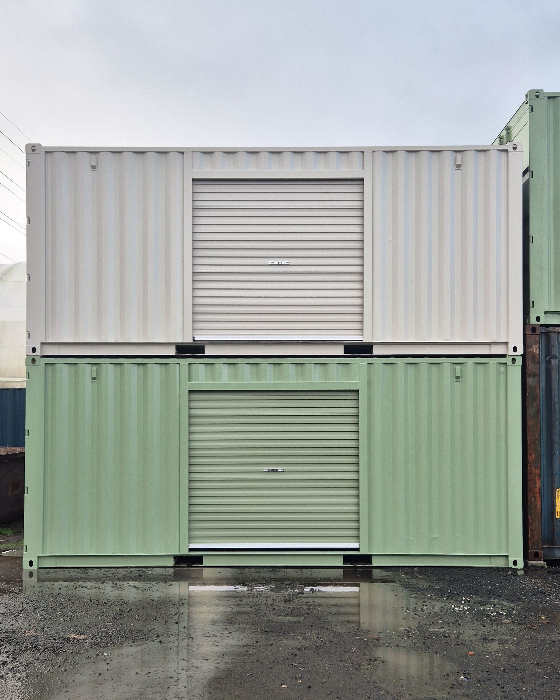 Two stacked shipping containers, white on top and green on bottom — East Coast Containers Shipping Containers and Transport in Chevallum, QLD
