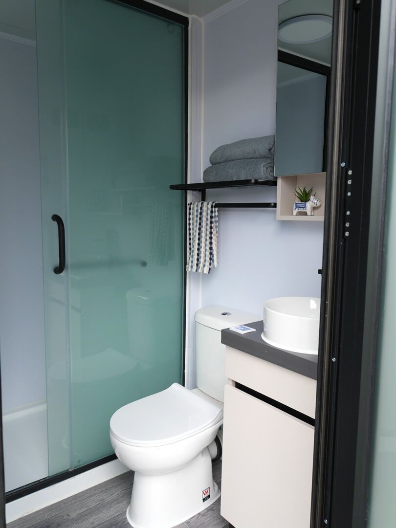Small Bathroom With Frosted Glass Shower — East Coast Containers Shipping Containers and Transport in Chevallum, QLD
