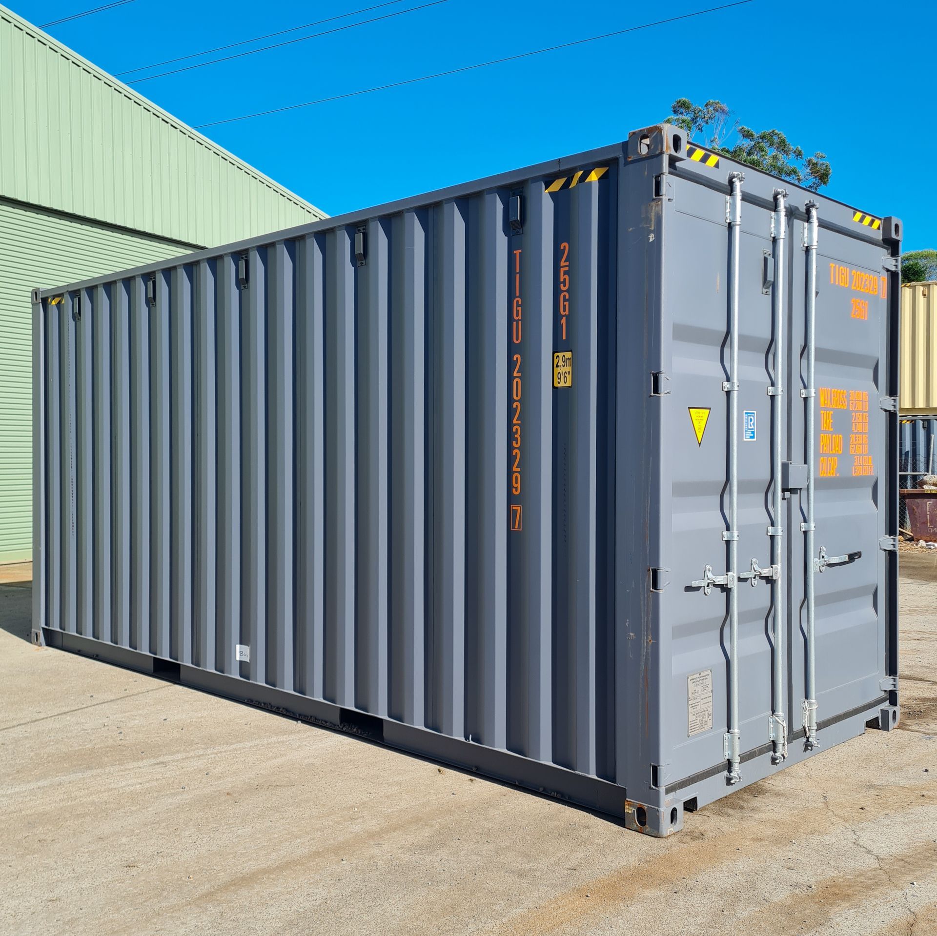 Gray Shipping Container on a Concrete — East Coast Containers Shipping Containers and Transport in Chevallum, QLD