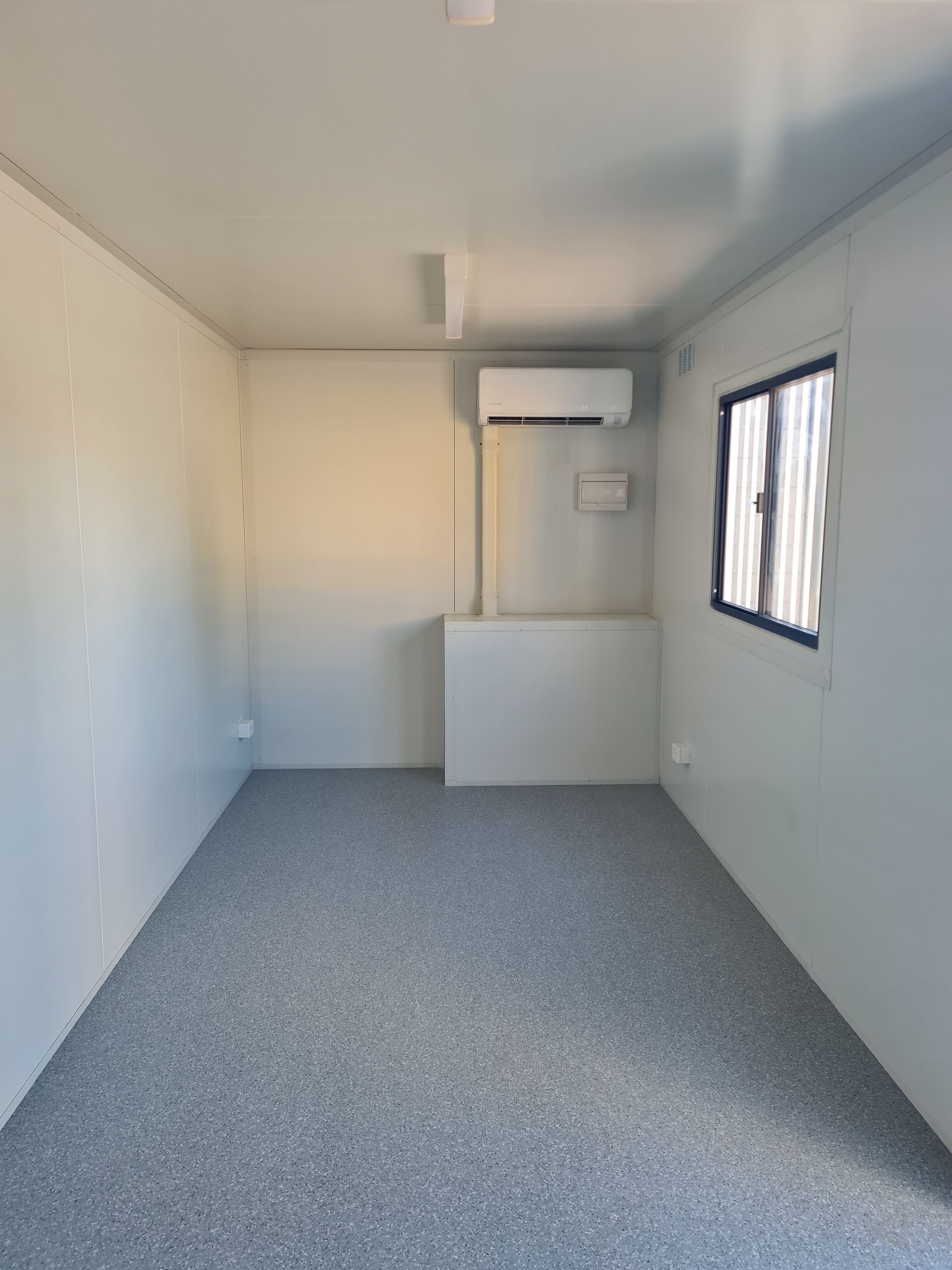 Empty Narrow Room With White Walls — East Coast Containers Shipping Containers and Transport in Chevallum, QLD