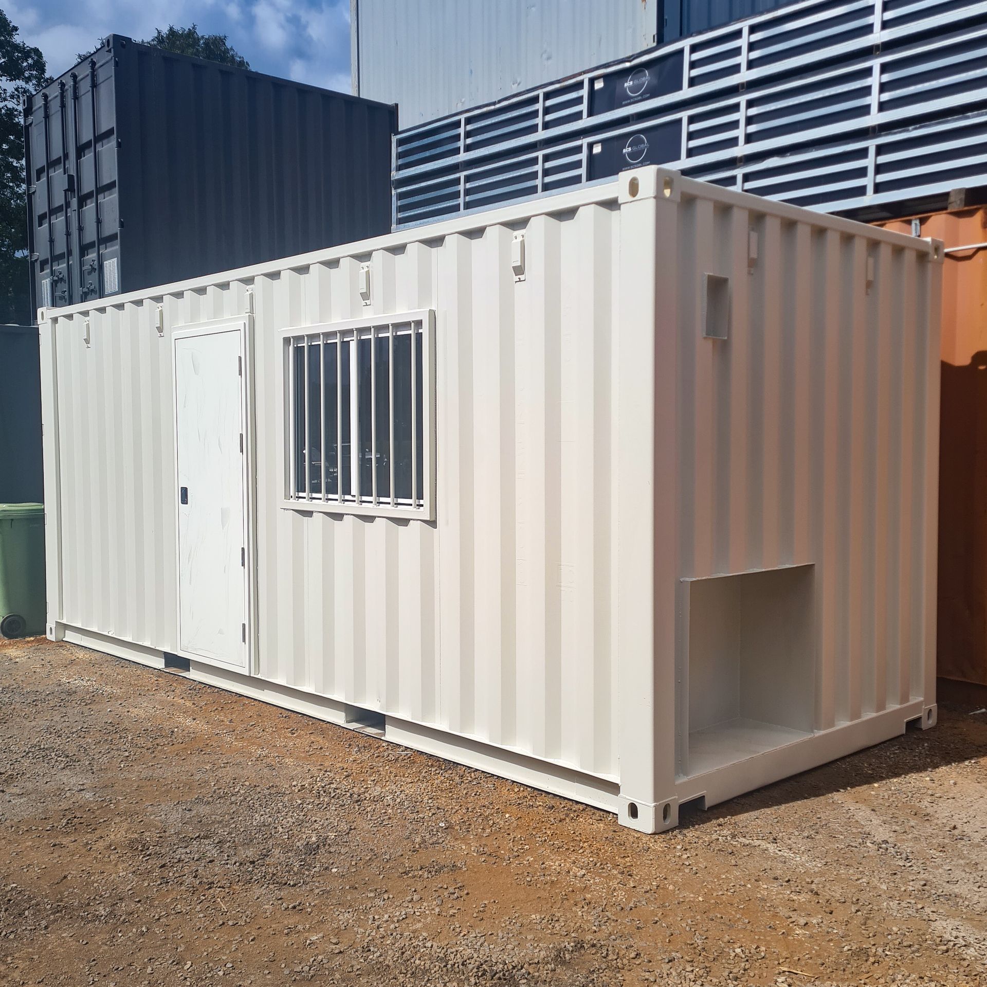 White portable container office with door and barred window — East Coast Containers Shipping Containers and Transport in Chevallum, QLD