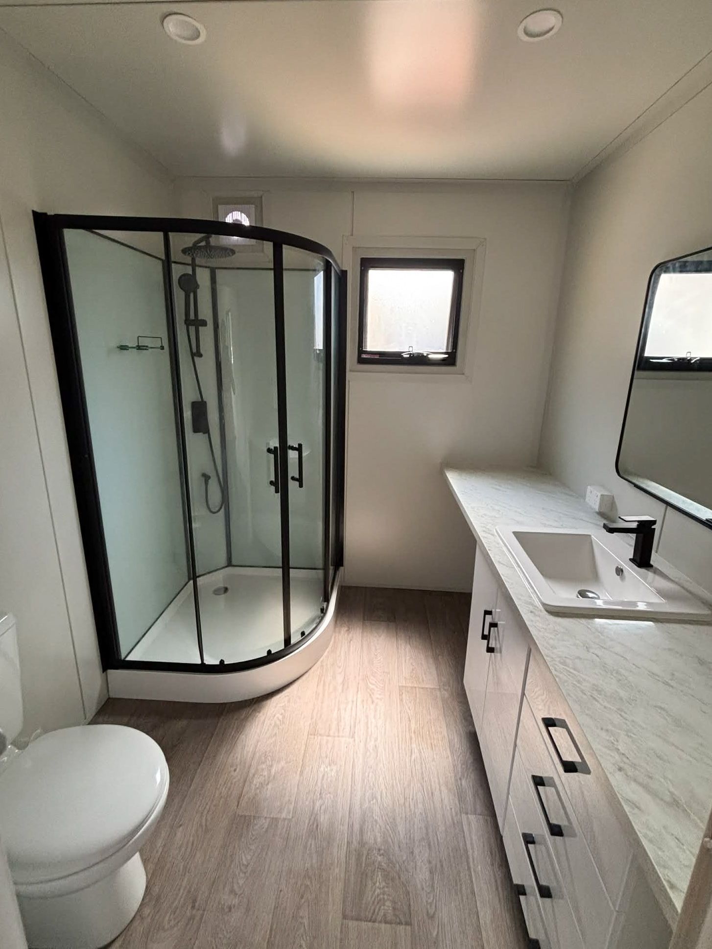Modern Bathroom With Glass Shower — East Coast Containers Shipping Containers and Transport in Chevallum, QLD