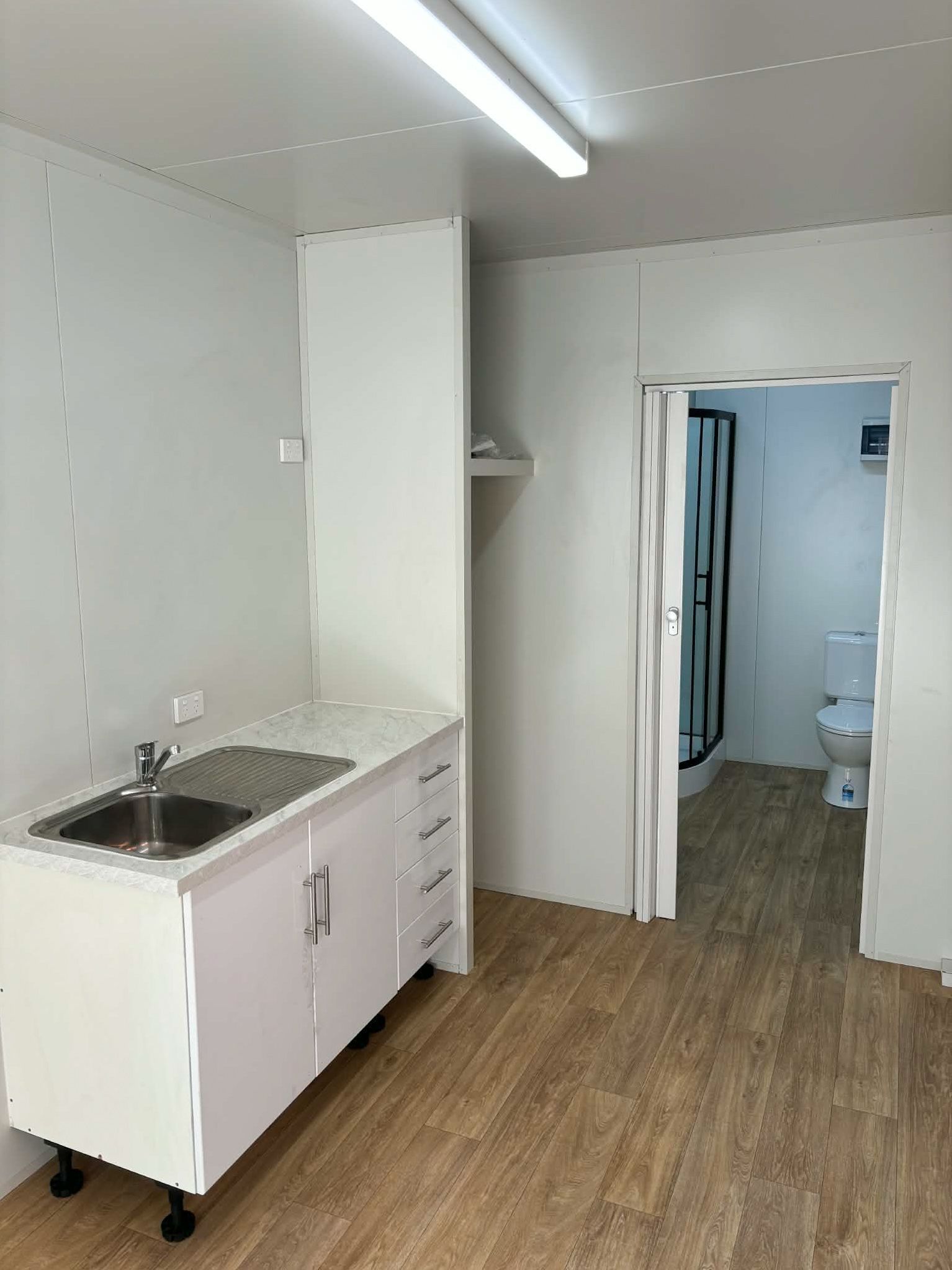 Small White Utility Room — East Coast Containers Shipping Containers and Transport in Chevallum, QLD