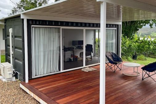 Modern Patio With Wooden Deck — East Coast Containers Shipping Containers and Transport in Chevallum, QLD