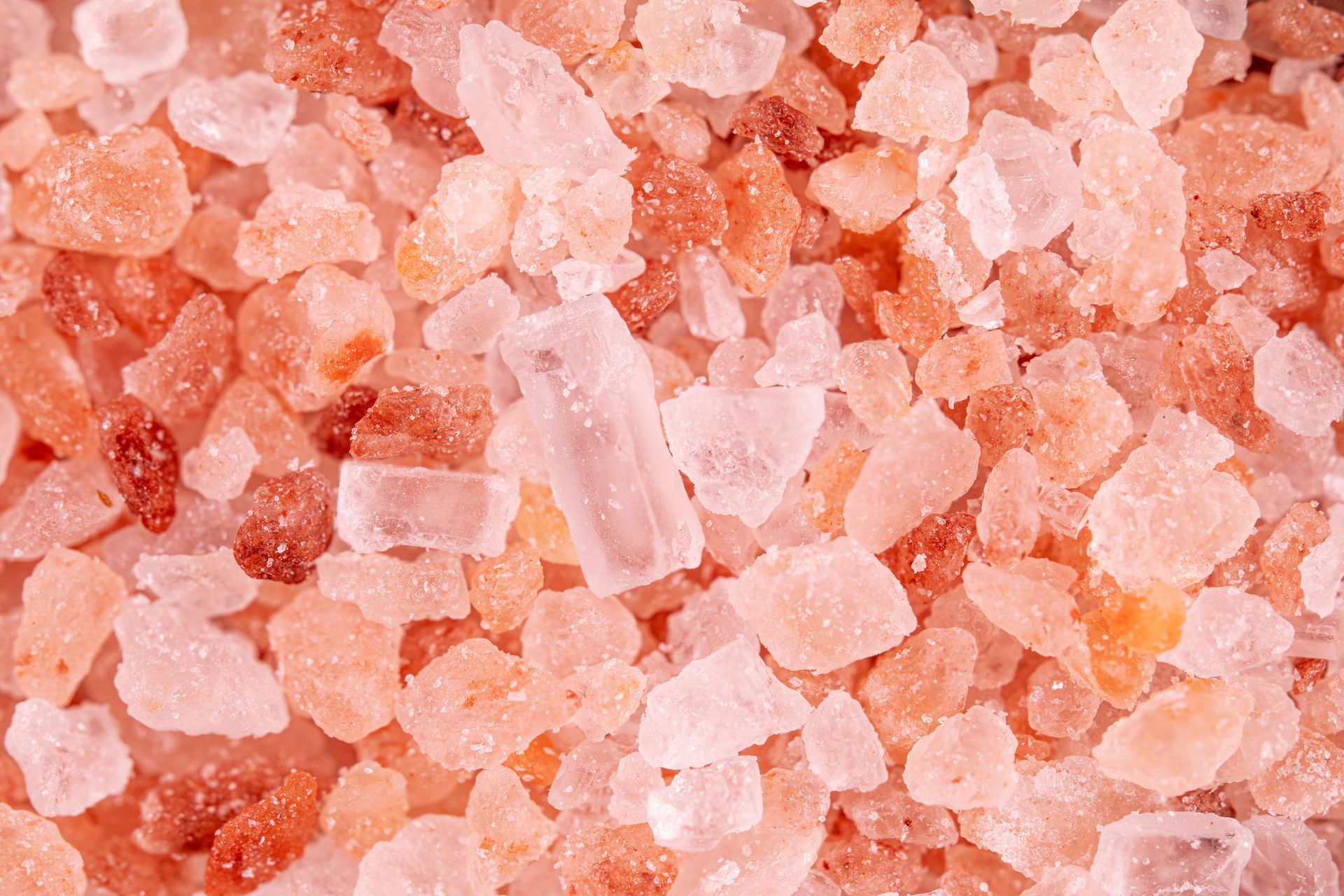 Pink coarse sea salt crystals filling the frame
