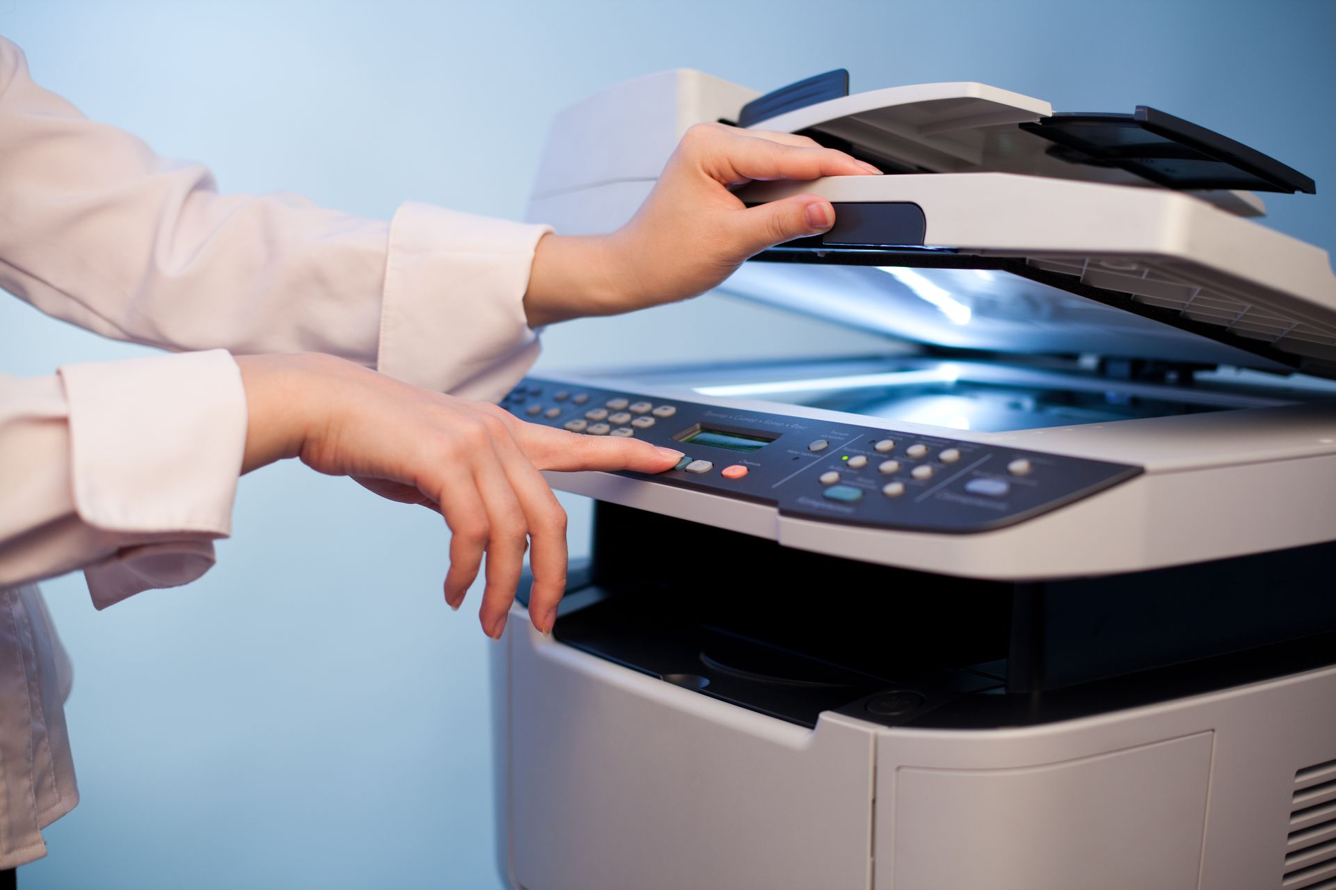 woman making a copy of a document