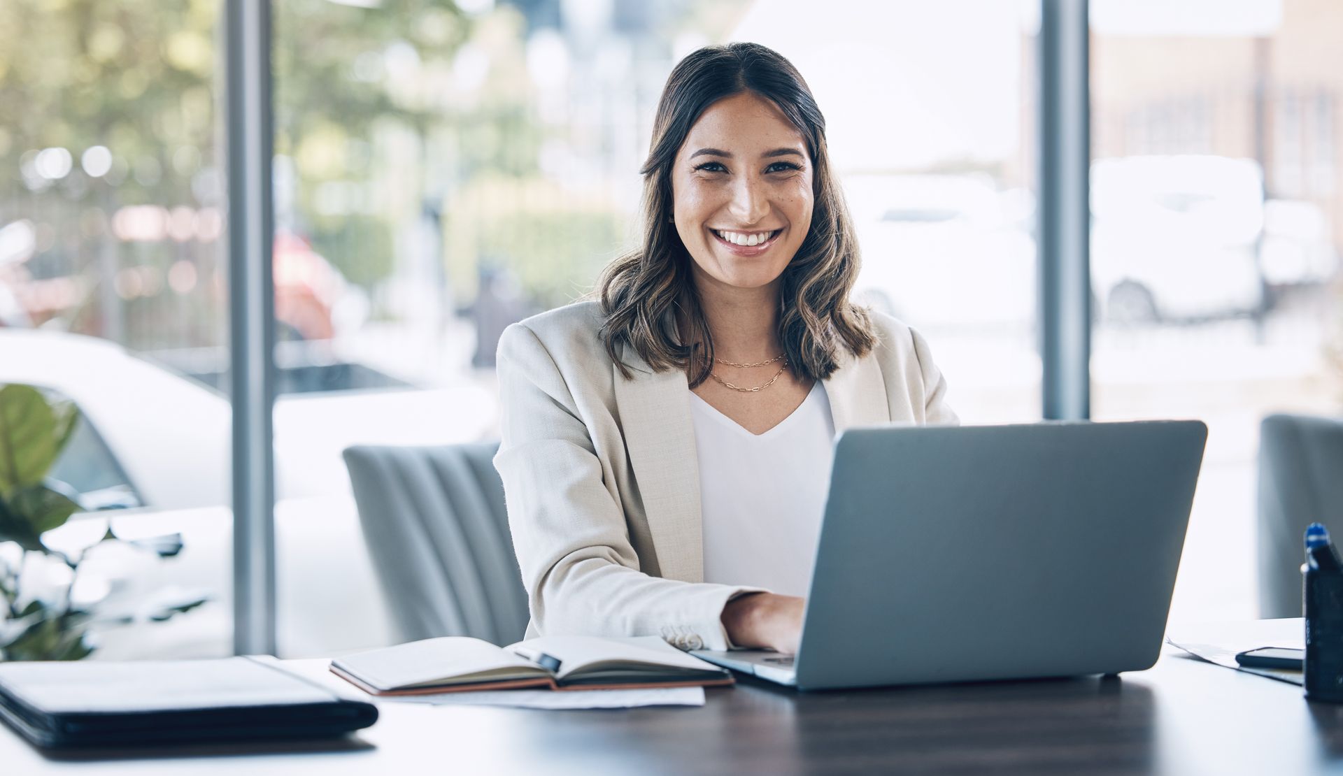woman accessing cloud services from laptop