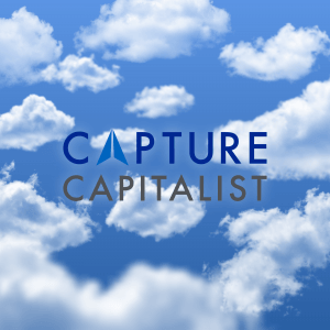 A blue sky with white clouds and the words capture capitalist