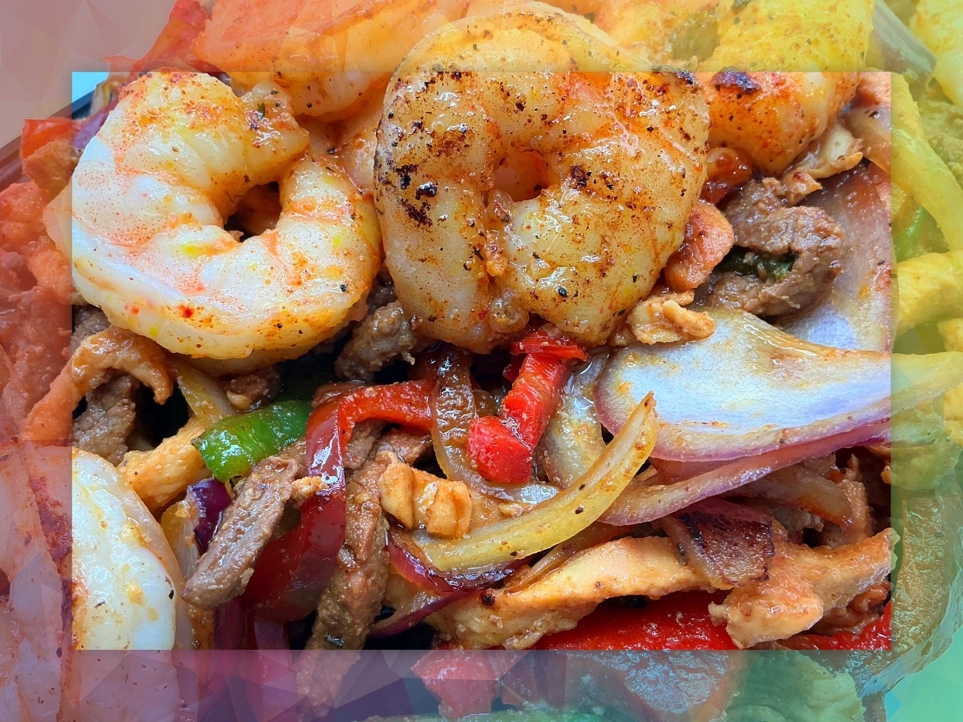 Grilled shrimp and vegetables with chips.