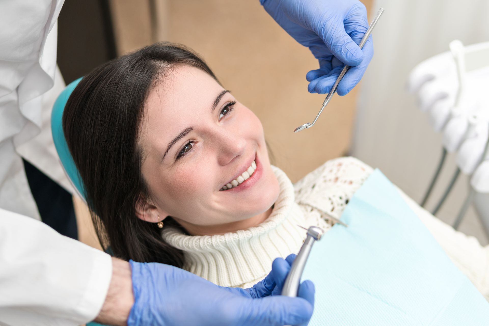 Relaxed woman receiving high-quality dentist services in a modern, comfortable office. Relaxed woman receiving high-quality dentist services in a modern, comfortable office.