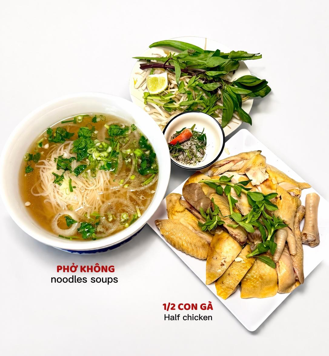 Vietnames restaurant meal: pho noodle soup with herbs and a plate of crispy half chicken and salad.