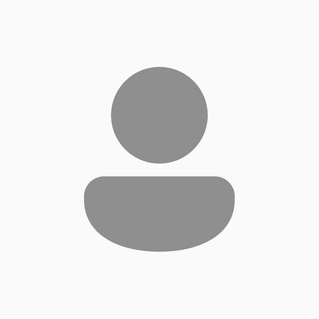 Gray silhouette of a person, consisting of a circle on top of a rounded rectangle.