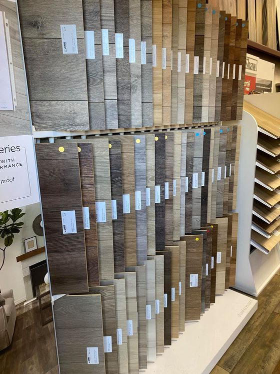 A display of different types of wooden flooring in a store.
