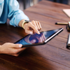 Woman pointing on digital tablet screen