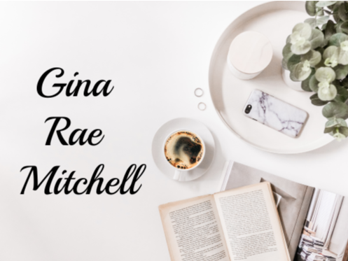 White desk with coffee, open book, phone, and tray of plants and a name: