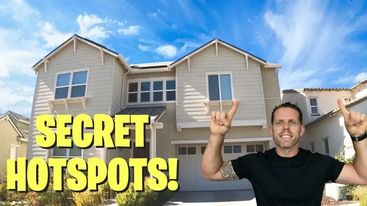 Man in black shirt stands before beige houses under blue sky with bold yellow text “SECRET HOTSPOTS!”