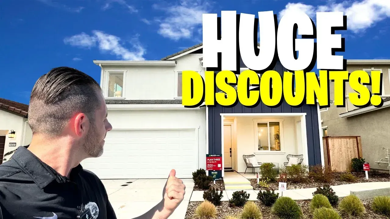 Man gesturing at a suburban house with bold text “HUGE DISCOUNTS!”