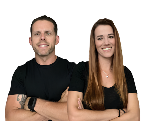 Two people standing with arms crossed, both in black shirts, smiling against a white background