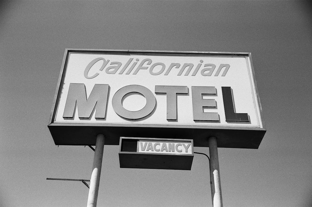 Black-and-white motel sign reading “Californian MOTEL” with a vacancy sign below