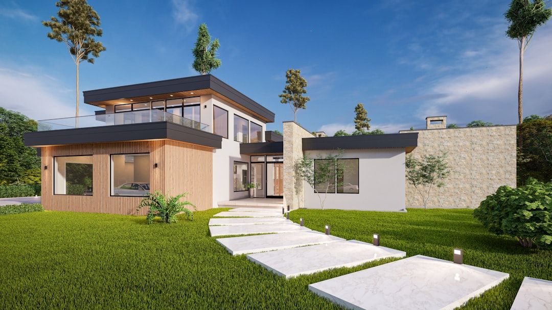 Modern house exterior with white walls, wood accents, glass windows, and a green lawn under a blue sky