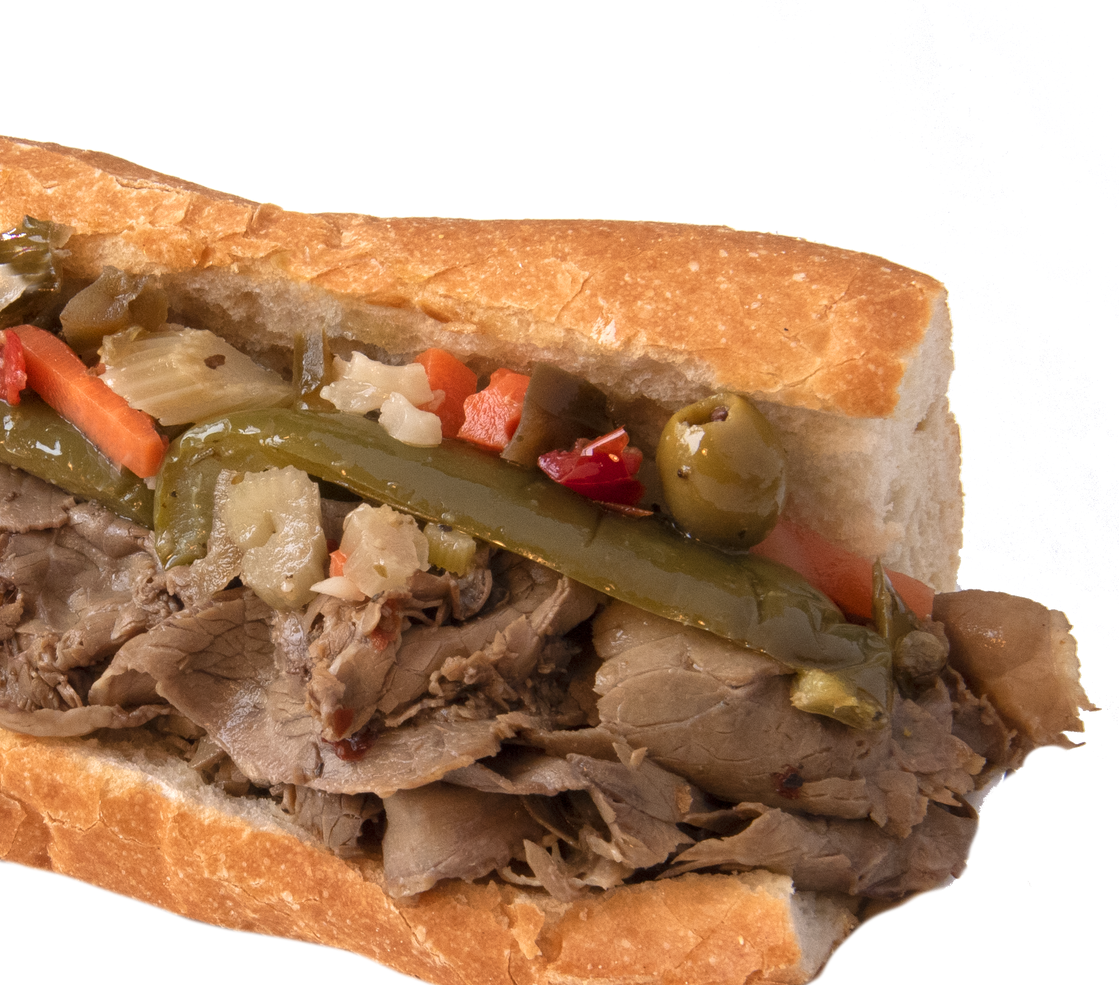 A sub sandwich with meat and vegetables on a white background