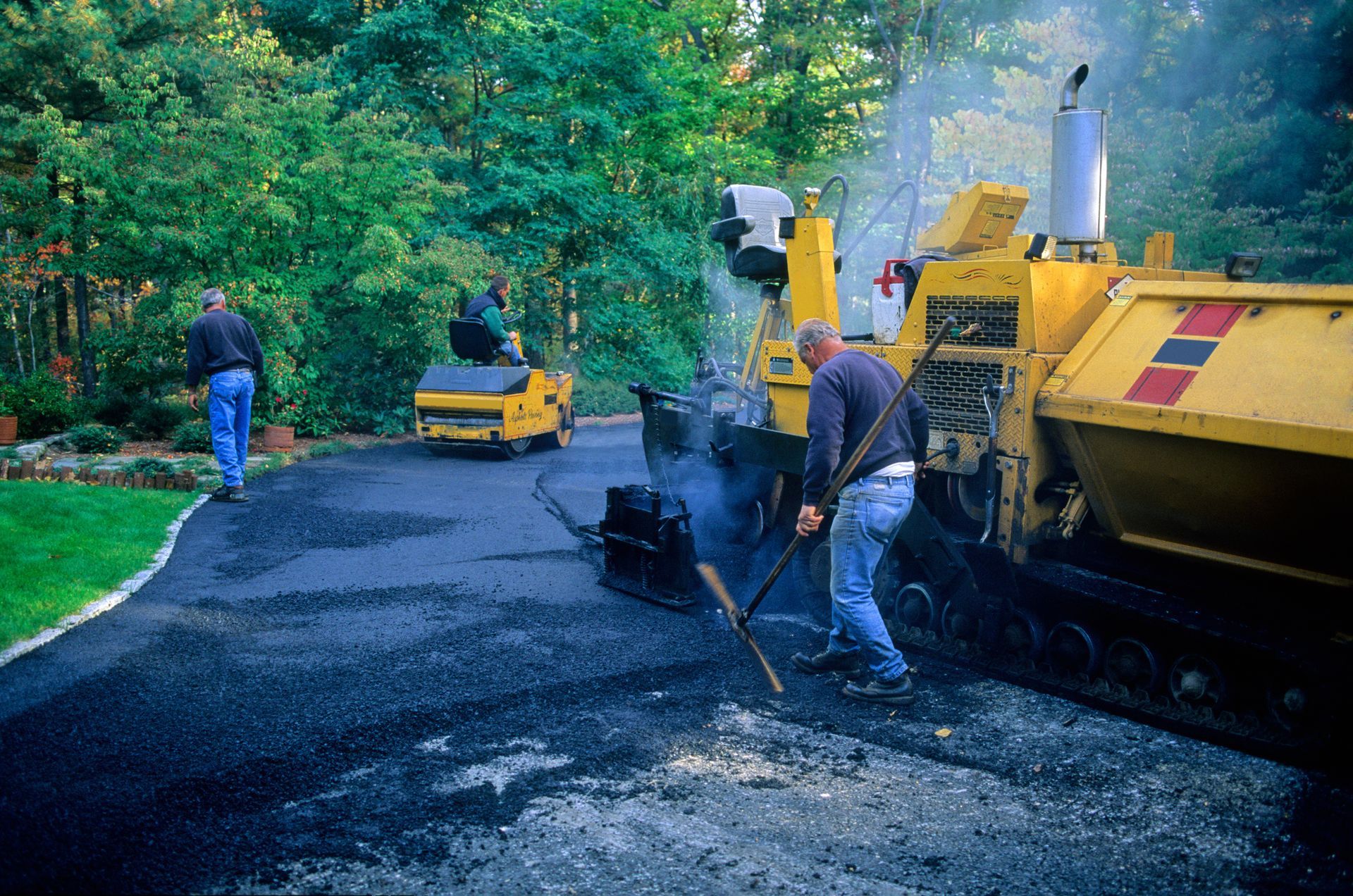 Expert paving crew delivering a smooth, lasting driveway finish with precision and care.
