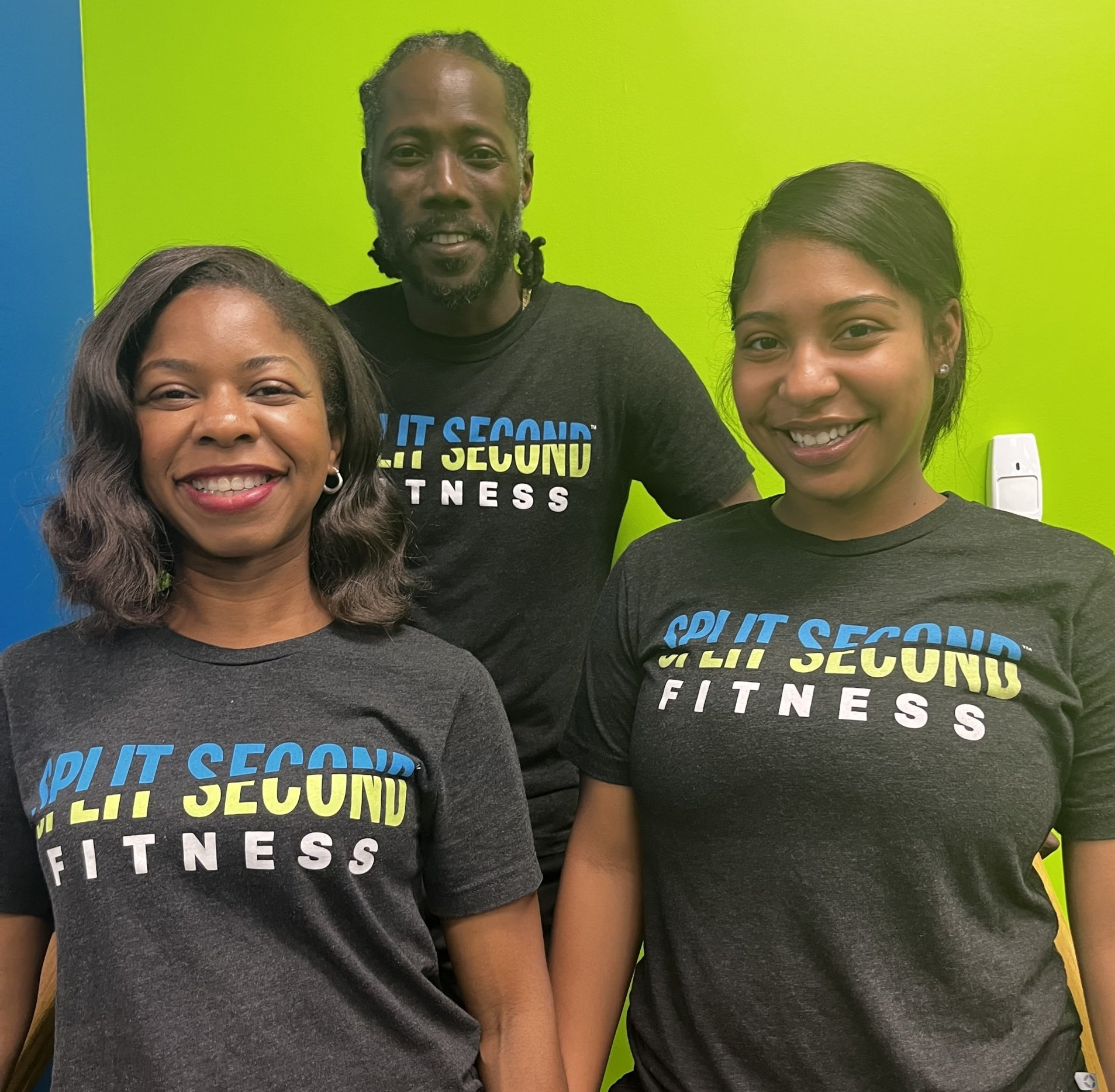 Three people wearing black shirts that say join it second fitness